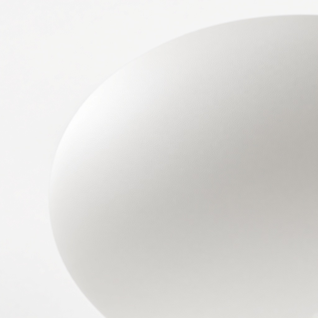 Primer plano de una superficie de vidrio blanco lechoso satinado.