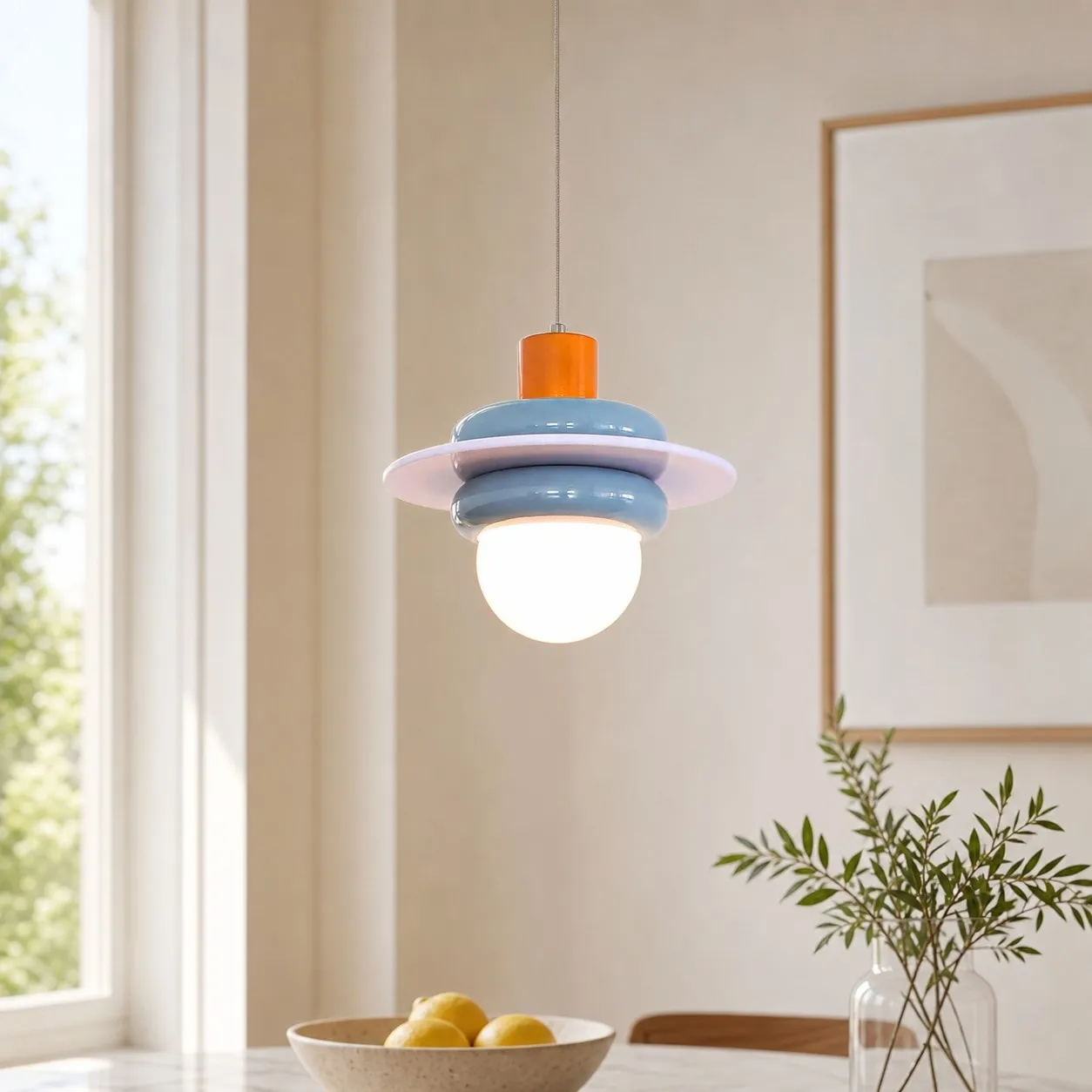 Sea salt blue pendant light installed near a bright window