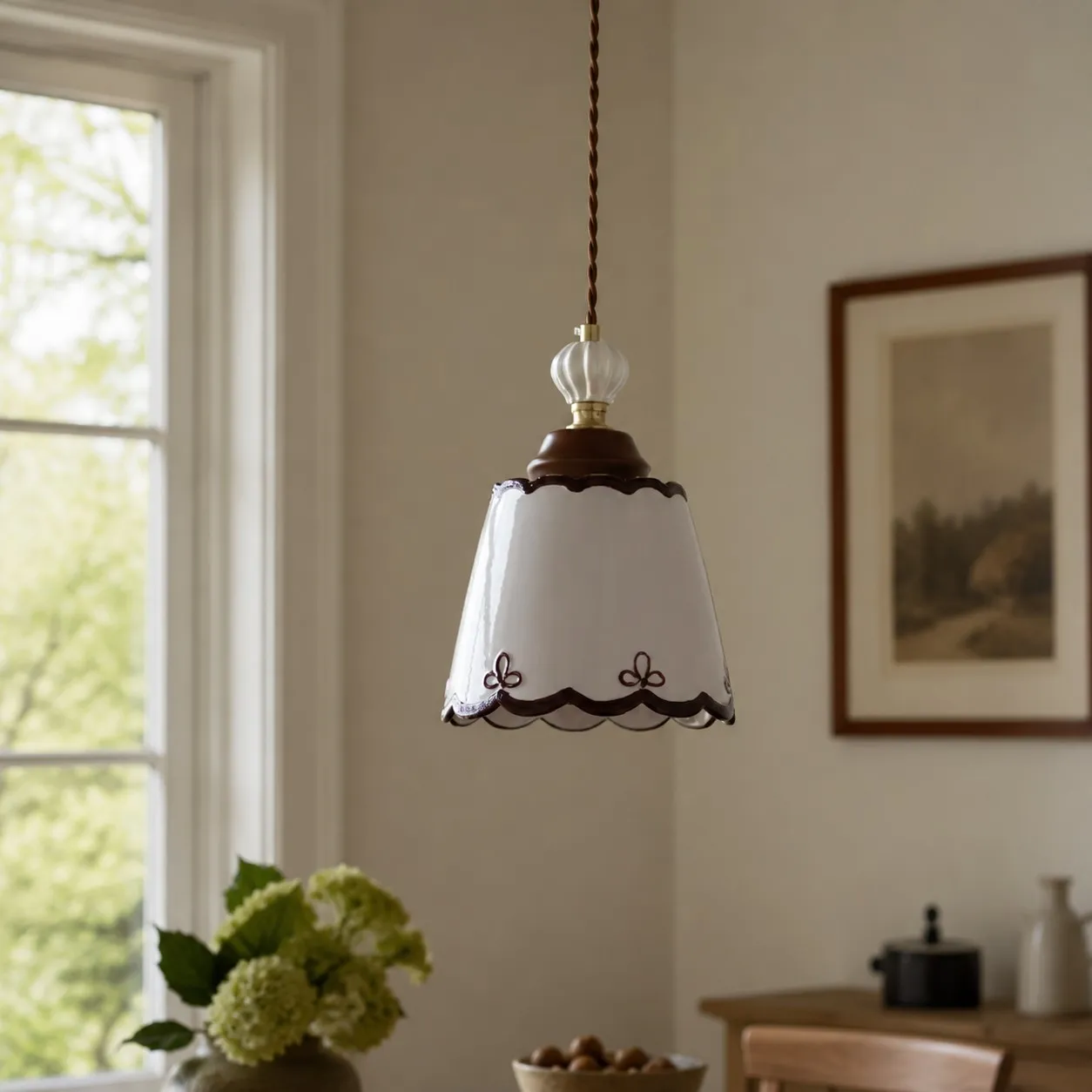 single ceramic pendant light in a warm dining corner