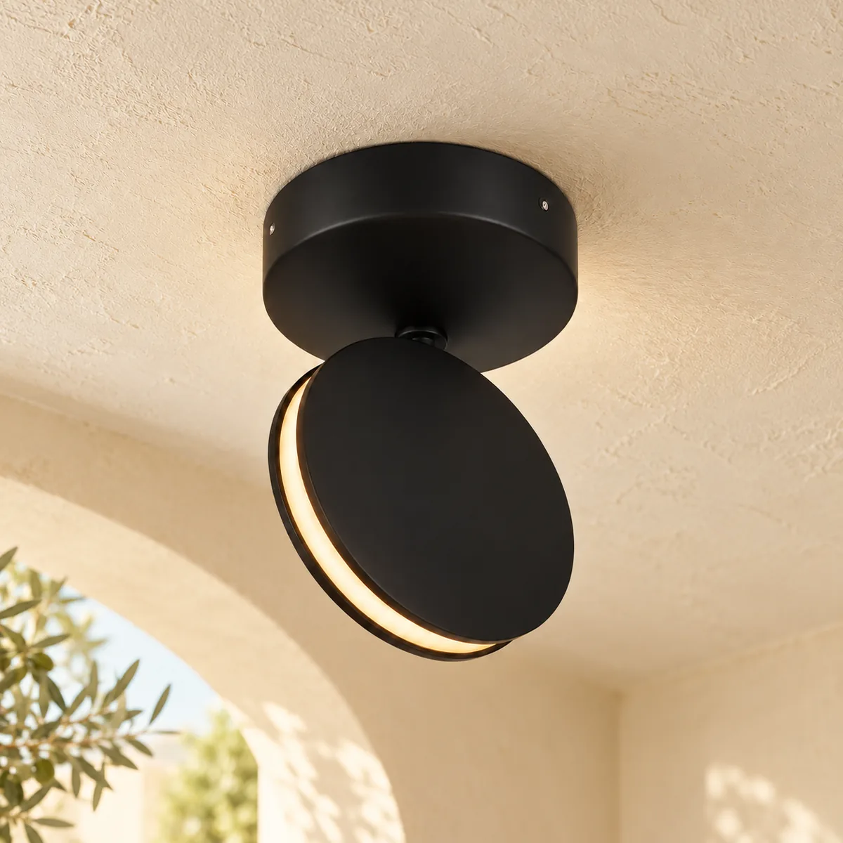 Black aluminium disc LED mounted on the ceiling